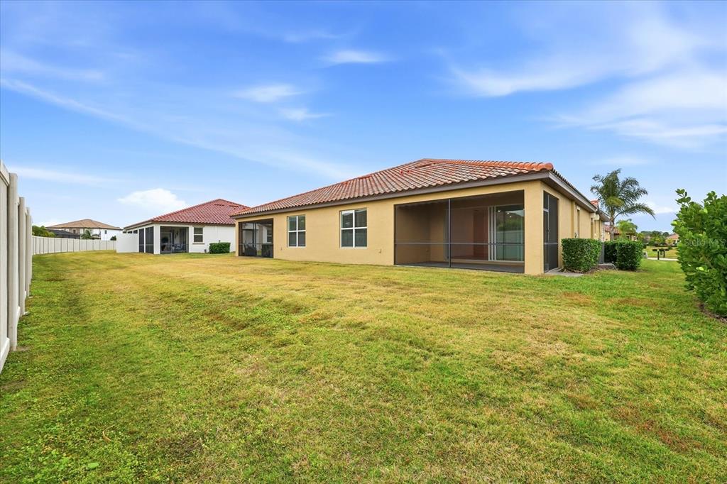2607 Avolet Court Lakewood Ranch, FL 34211 - Photo 29 of 56 a front view of a house with a garden