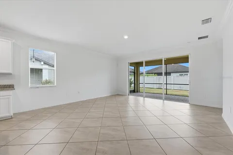 a large kitchen with stainless steel appliances granite countertop a large counter top and a stove top oven