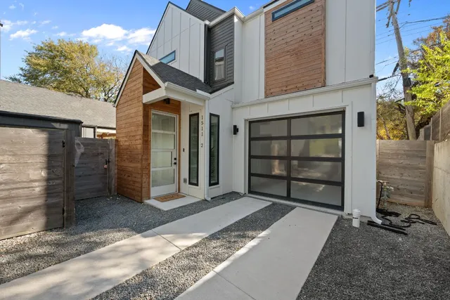 a front view of a house with a garage