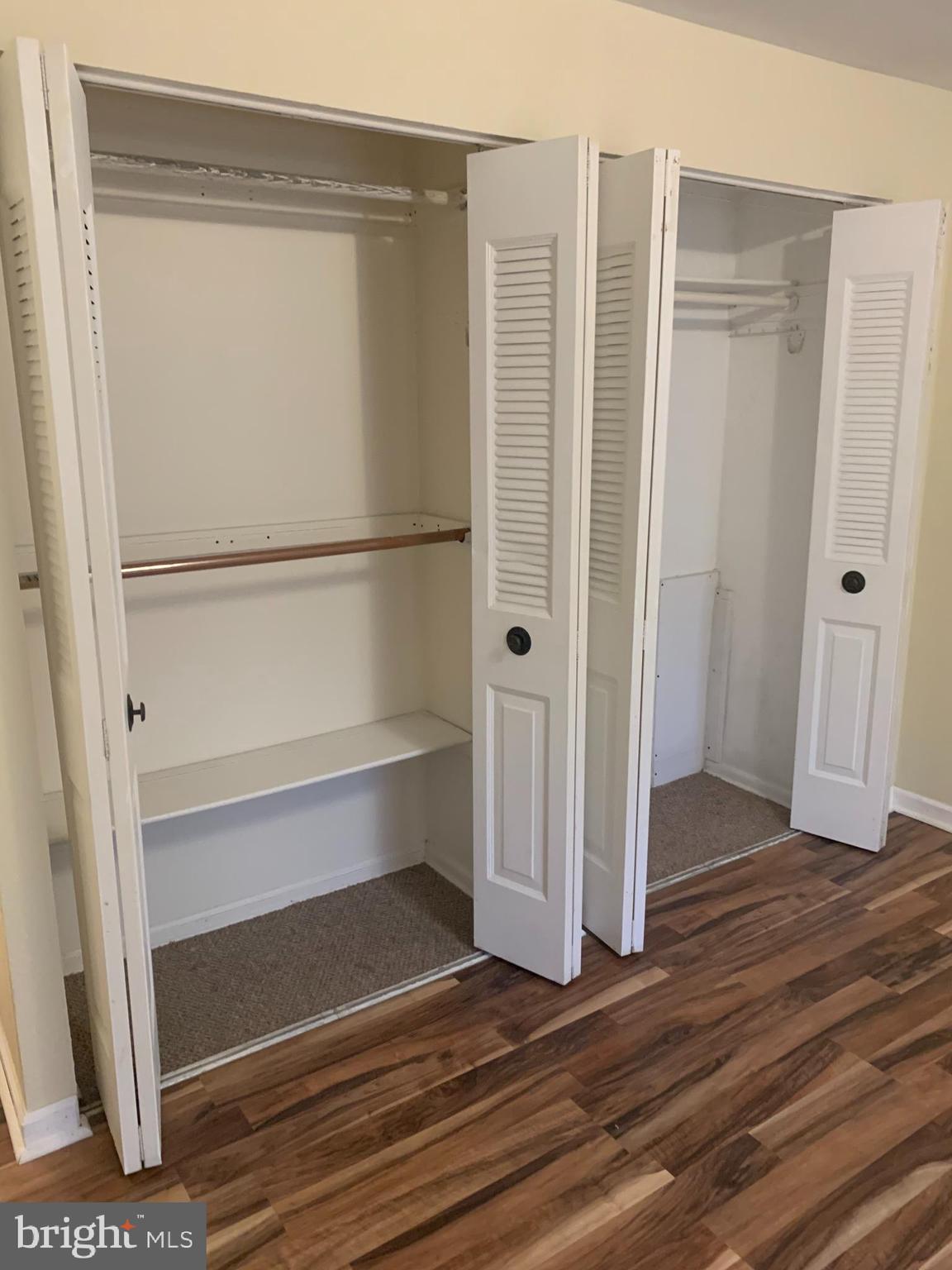 11410 Cherry Hill Road, Unit MB104 Beltsville, MD 20705 - Photo 2 of 8 a view of walk in closet with empty racks