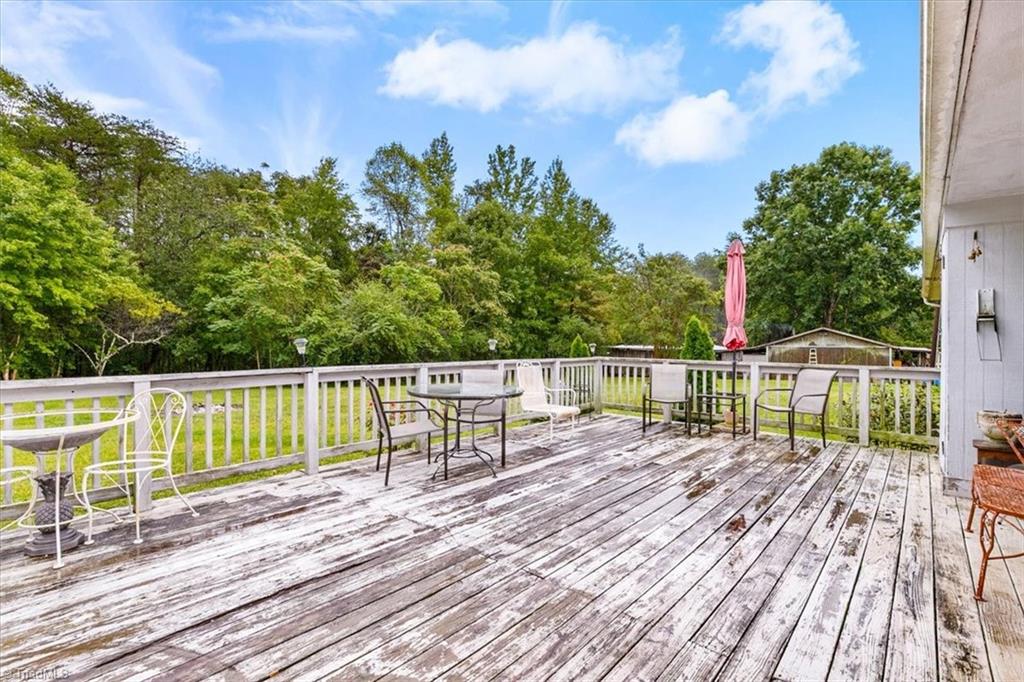 5822 Ruralview Road Gibsonville, NC 27249 - Photo 25 of 35 Large back deck overlooking the yard