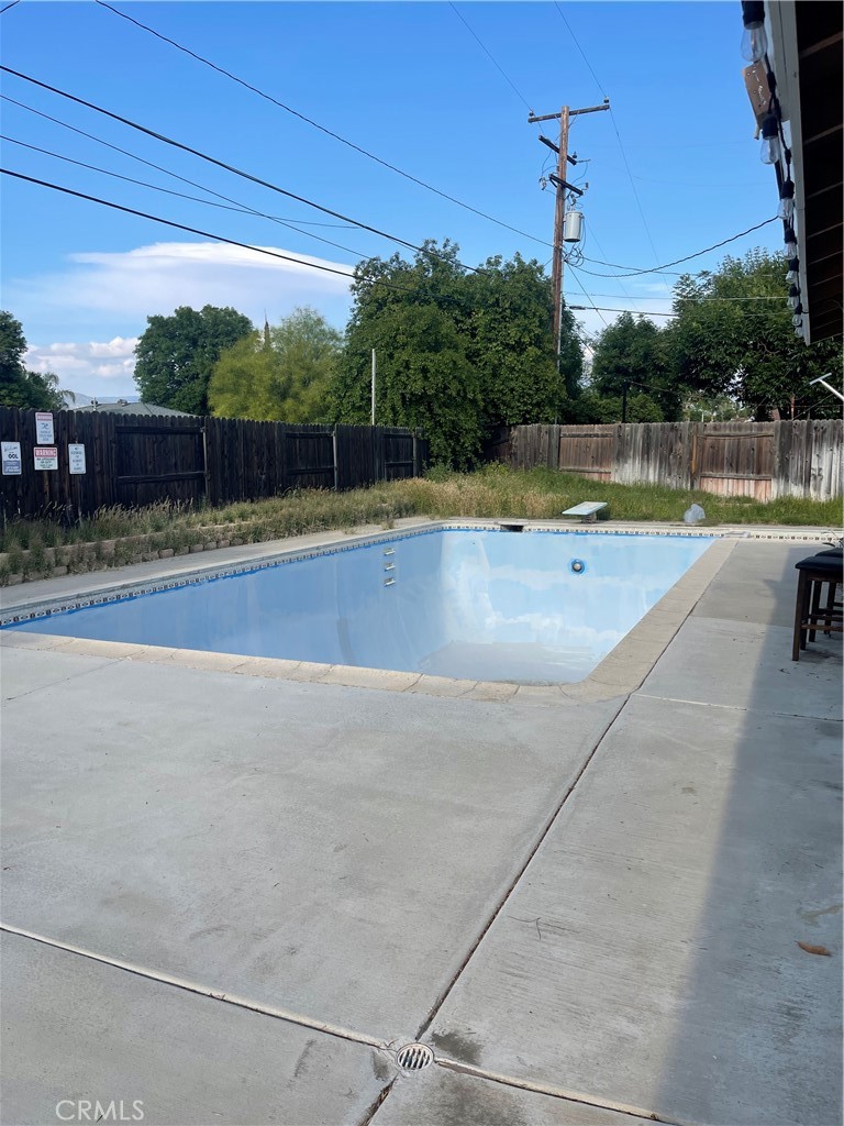 26380 Erwin Court Hemet, CA 92544 - Photo 12 of 12 a view of a swimming pool with a yard and plants