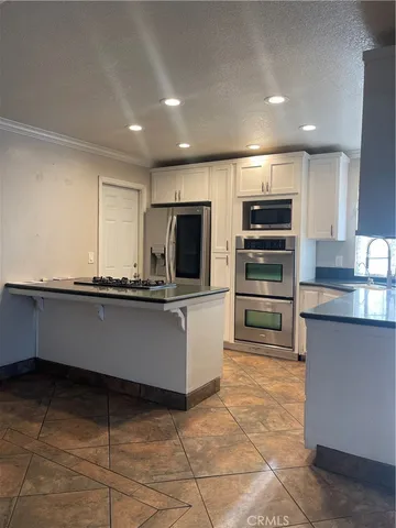 a view of wooden floor and windows in an empty room