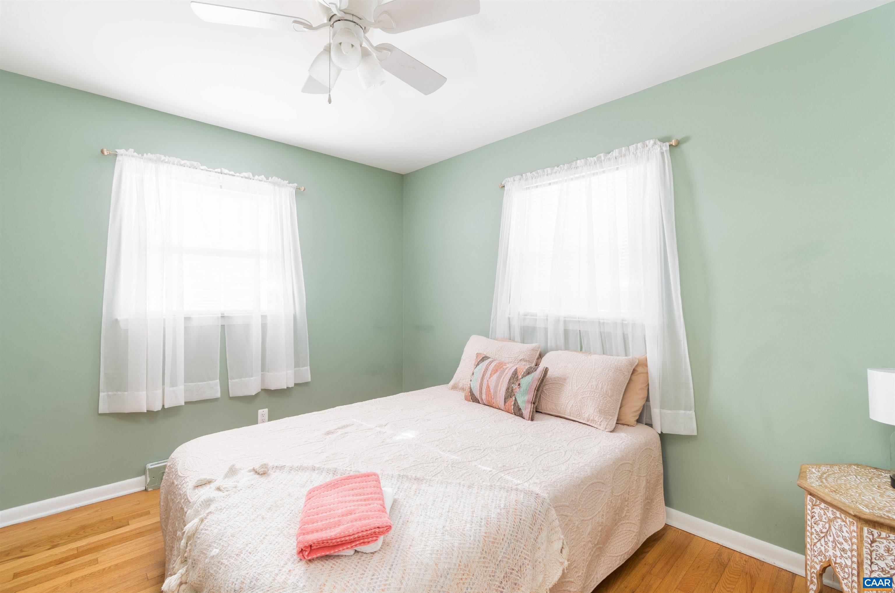 707 Rockcreek Road Charlottesville, VA 22903 - Photo 14 of 26 a bedroom with a bed and a window