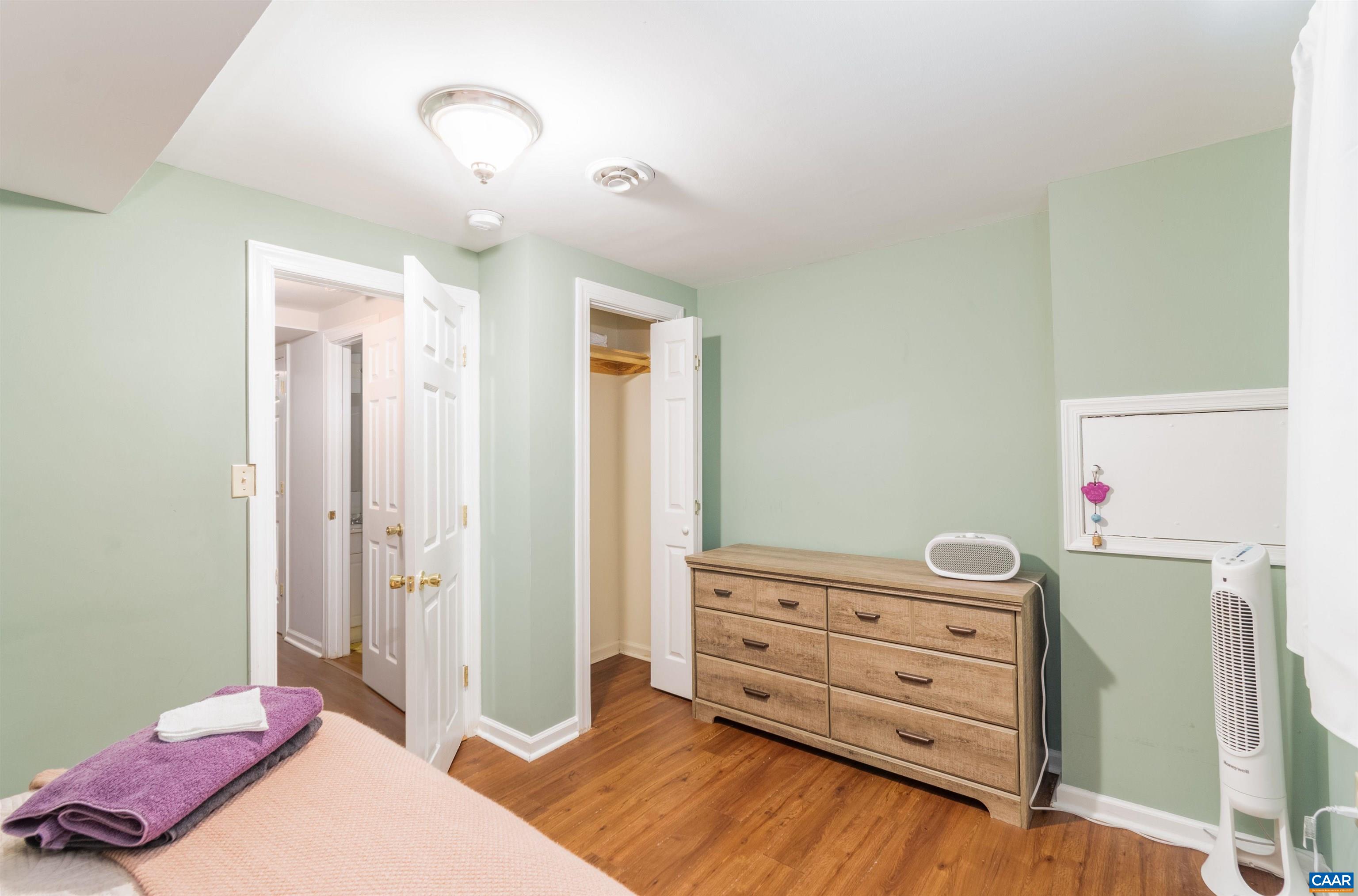707 Rockcreek Road Charlottesville, VA 22903 - Photo 19 of 26 a bedroom with a bed and a dresser