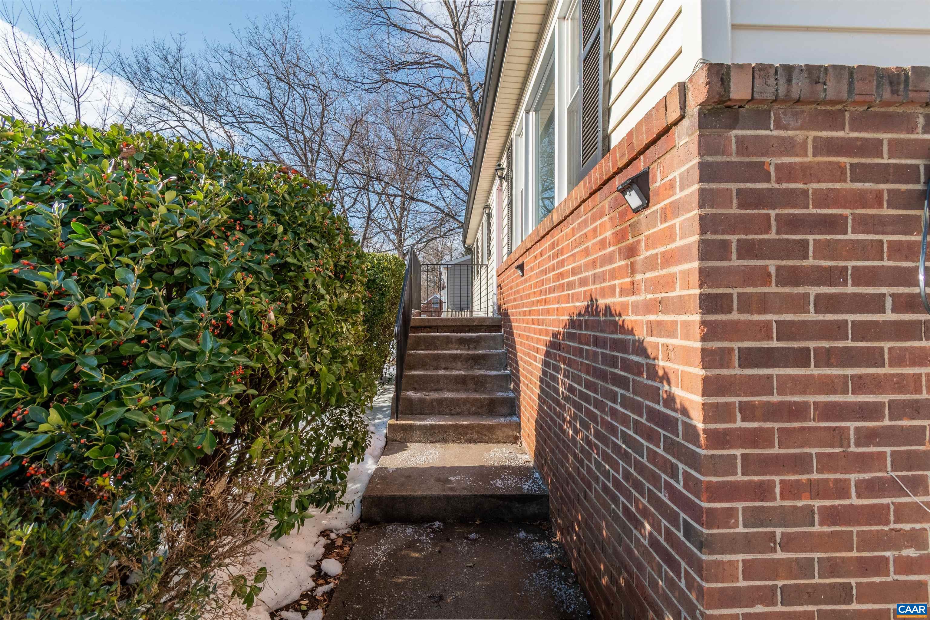 707 Rockcreek Road Charlottesville, VA 22903 - Photo 3 of 26 a view of a pathway both side of building