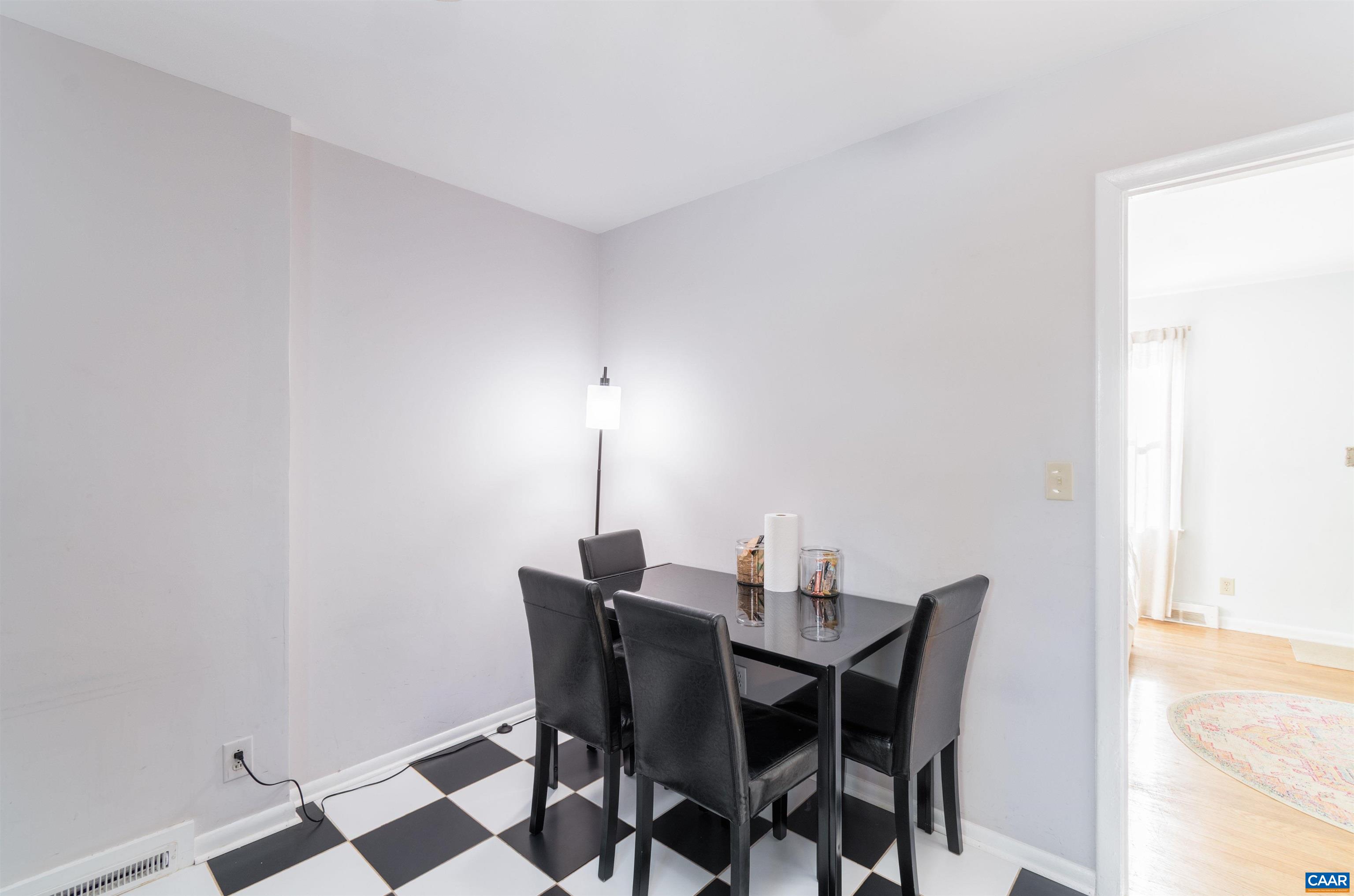 707 Rockcreek Road Charlottesville, VA 22903 - Photo 8 of 26 a view of a dining room with furniture and wooden floor