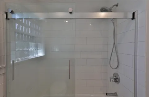 a view of a house with backyard and a tree