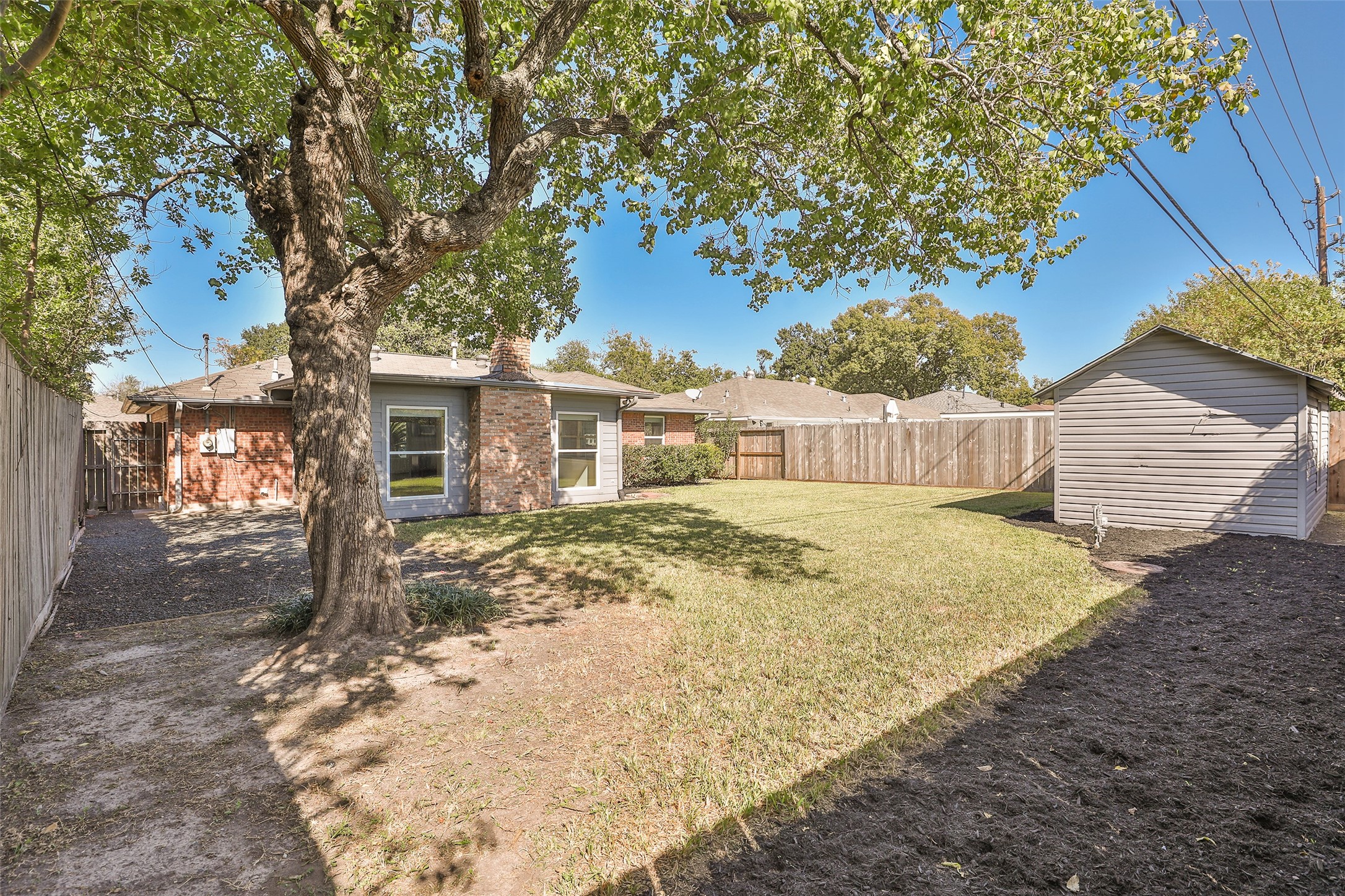 4613 Libbey Drive Houston, TX 77092 - Photo 24 of 26 a front view of a house with a yard