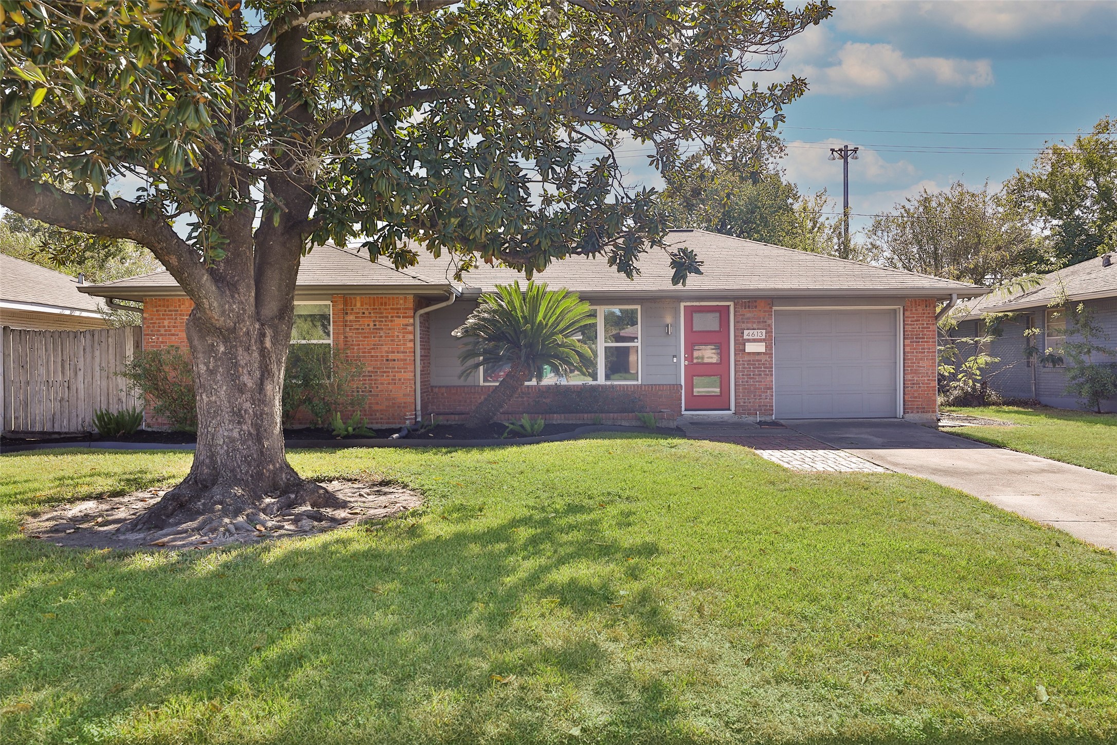 4613 Libbey Drive Houston, TX 77092 - Photo 26 of 26 a front view of a house with a yard and garage