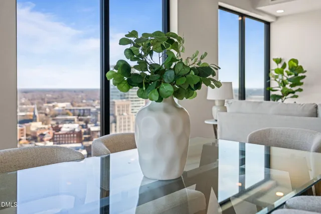 a living room with furniture and flower pot