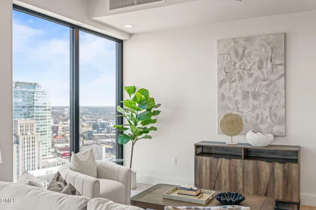 a living room with fireplace furniture and a wooden floor