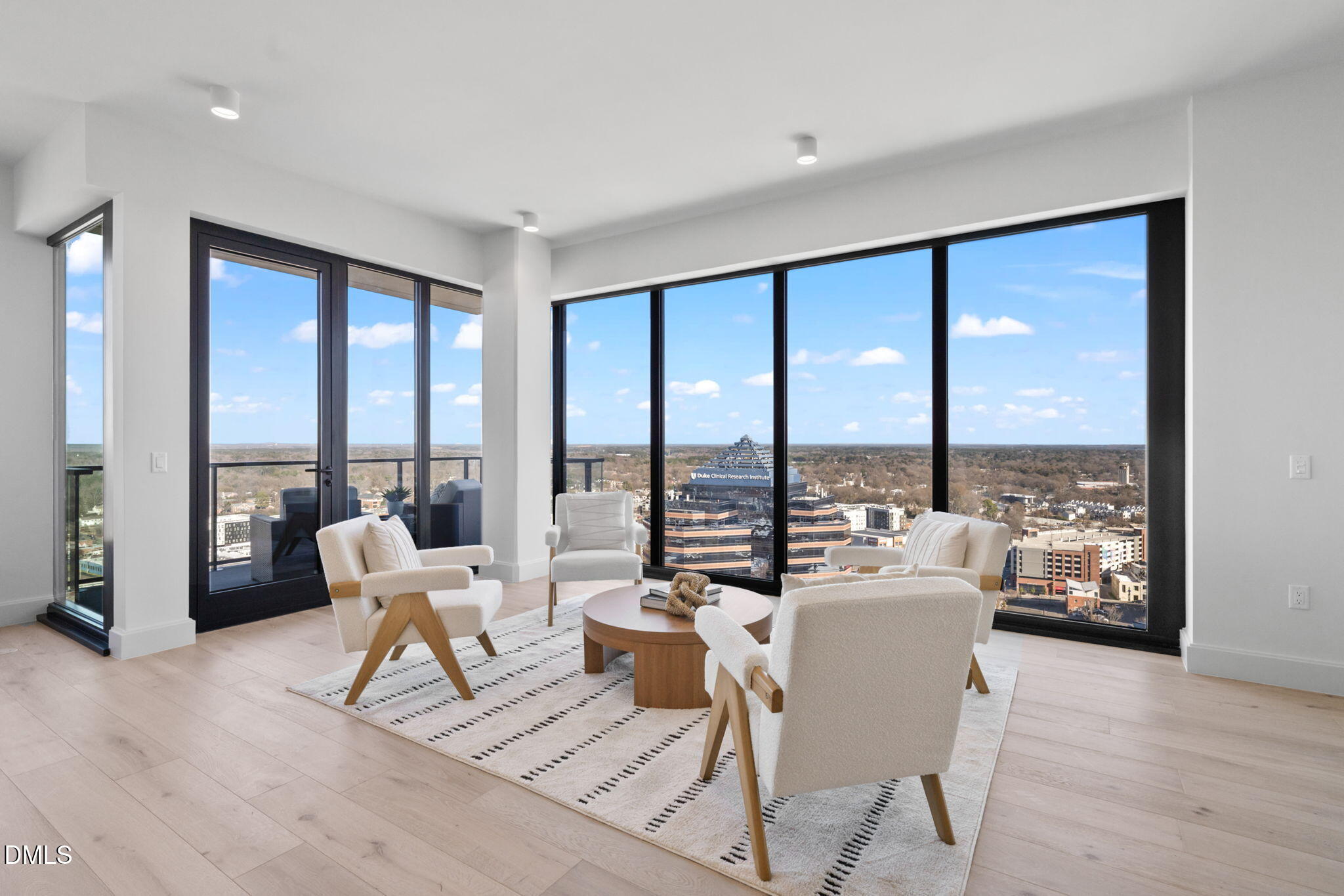 115 Morris Street, Unit 2502 Durham, NC 27701 - Photo 20 of 72 a living room with furniture and floor to ceiling windows