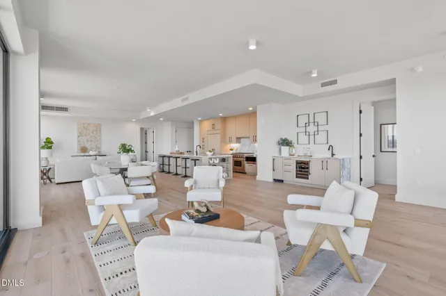 a bedroom with a bed mirror and window