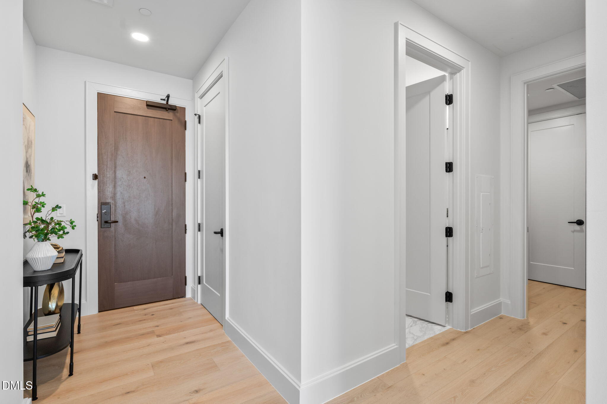 115 Morris Street, Unit 2502 Durham, NC 27701 - Photo 3 of 72 a view of a hallway with wooden floor and closet area