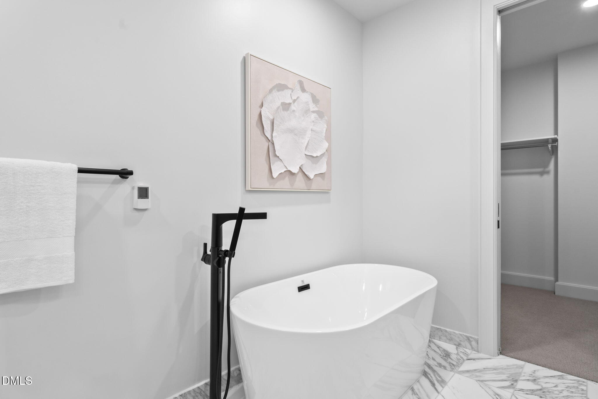 115 Morris Street, Unit 2502 Durham, NC 27701 - Photo 35 of 72 a white bath tub sitting next to a white sink and vanity