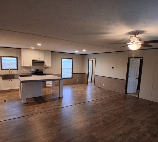 798 North 4190 Road Hugo, OK 74743 - Photo 4 of 16 a view of kitchen with sink and wooden floor
