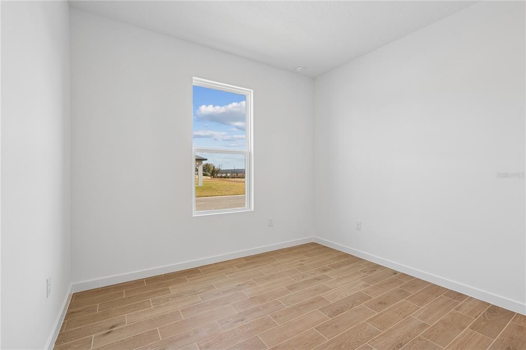 4521 Northwest 37th St Road Ocala, FL 34482 - Photo 4 of 14 an empty room with a window