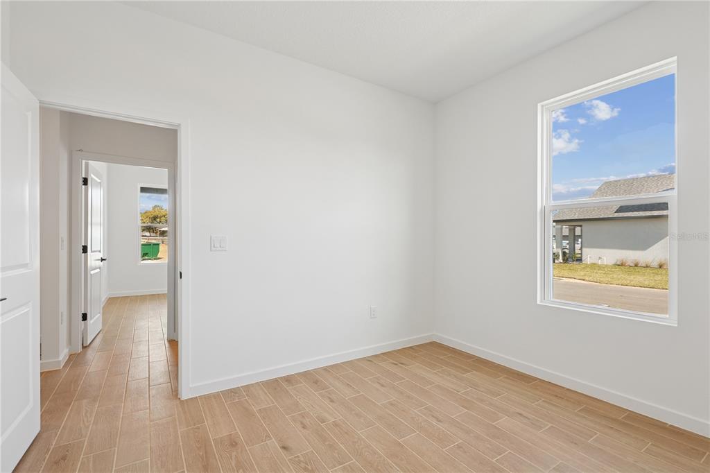 4521 Northwest 37th St Road Ocala, FL 34482 - Photo 5 of 14 a view of an empty room and wooden floor