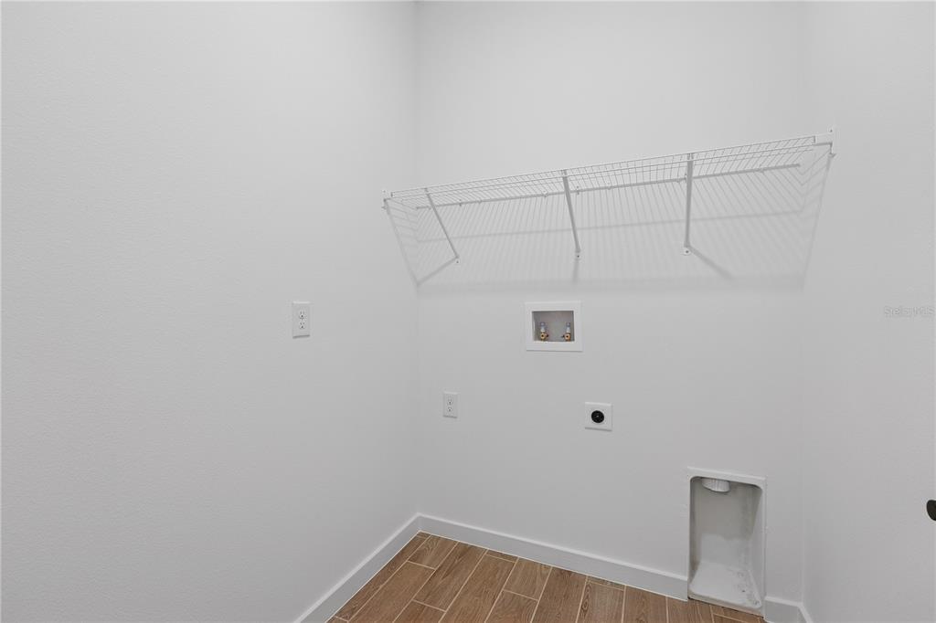4521 Northwest 37th St Road Ocala, FL 34482 - Photo 7 of 14 a view of a room with racks on the wall