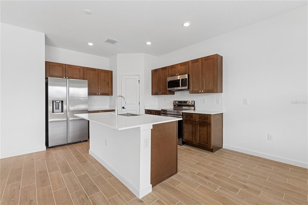 4521 Northwest 37th St Road Ocala, FL 34482 - Photo 9 of 14 a kitchen with a sink appliances and cabinets