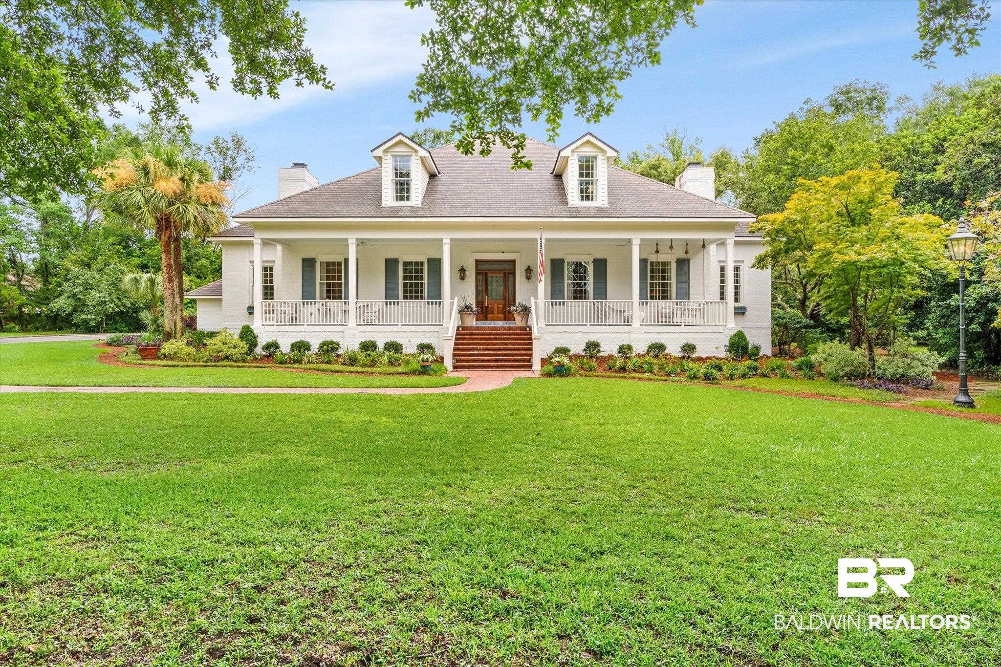 6458 Raintree Road Fairhope, AL 36532 - Photo 1 of 65 View of front of property featuring covered porch and a front yard