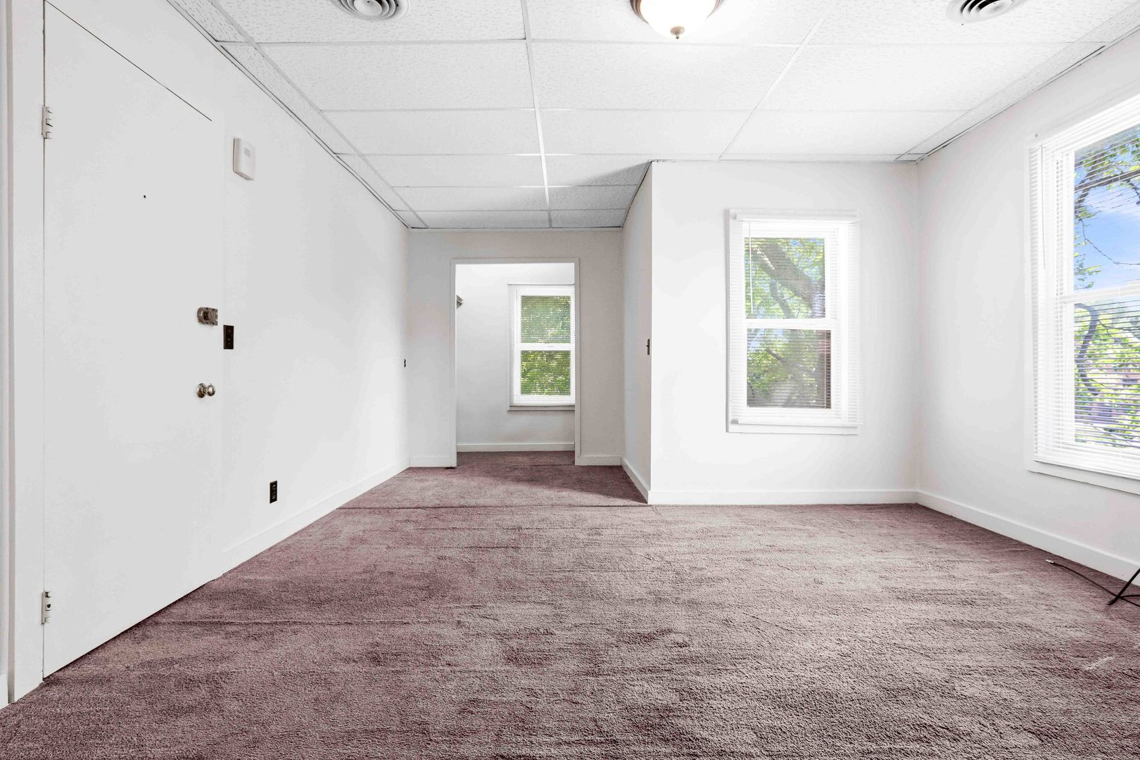 410 East Grove Street Bloomington, IL 61701 - Photo 17 of 25 an empty room with windows