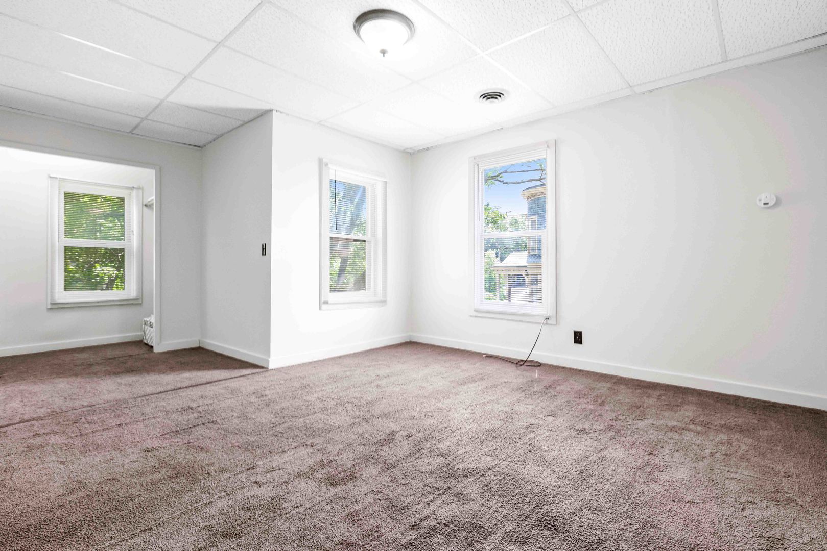 410 East Grove Street Bloomington, IL 61701 - Photo 18 of 25 an empty room with windows