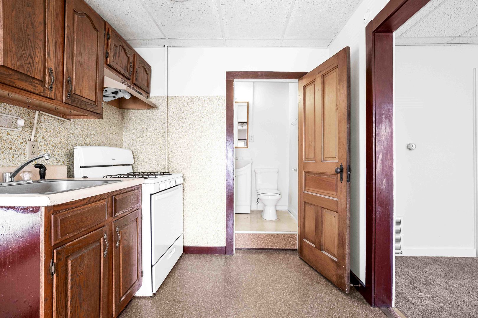 410 East Grove Street Bloomington, IL 61701 - Photo 22 of 25 a kitchen with stainless steel appliances granite countertop a refrigerator and a sink