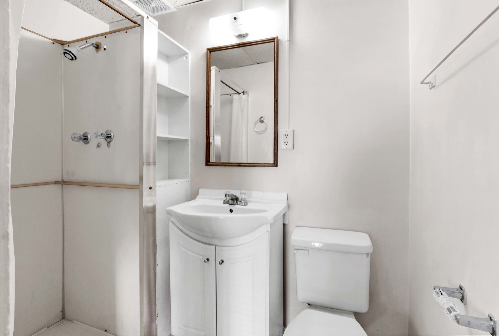 410 East Grove Street Bloomington, IL 61701 - Photo 24 of 25 a bathroom with a toilet sink and mirror