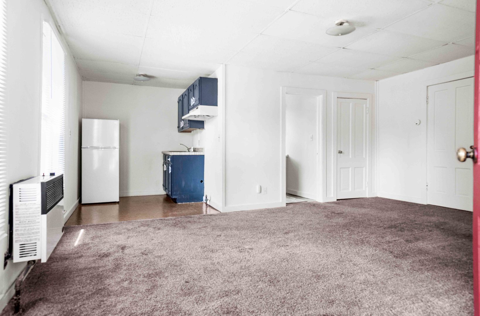 410 East Grove Street Bloomington, IL 61701 - Photo 9 of 25 a view of a livingroom with an empty space