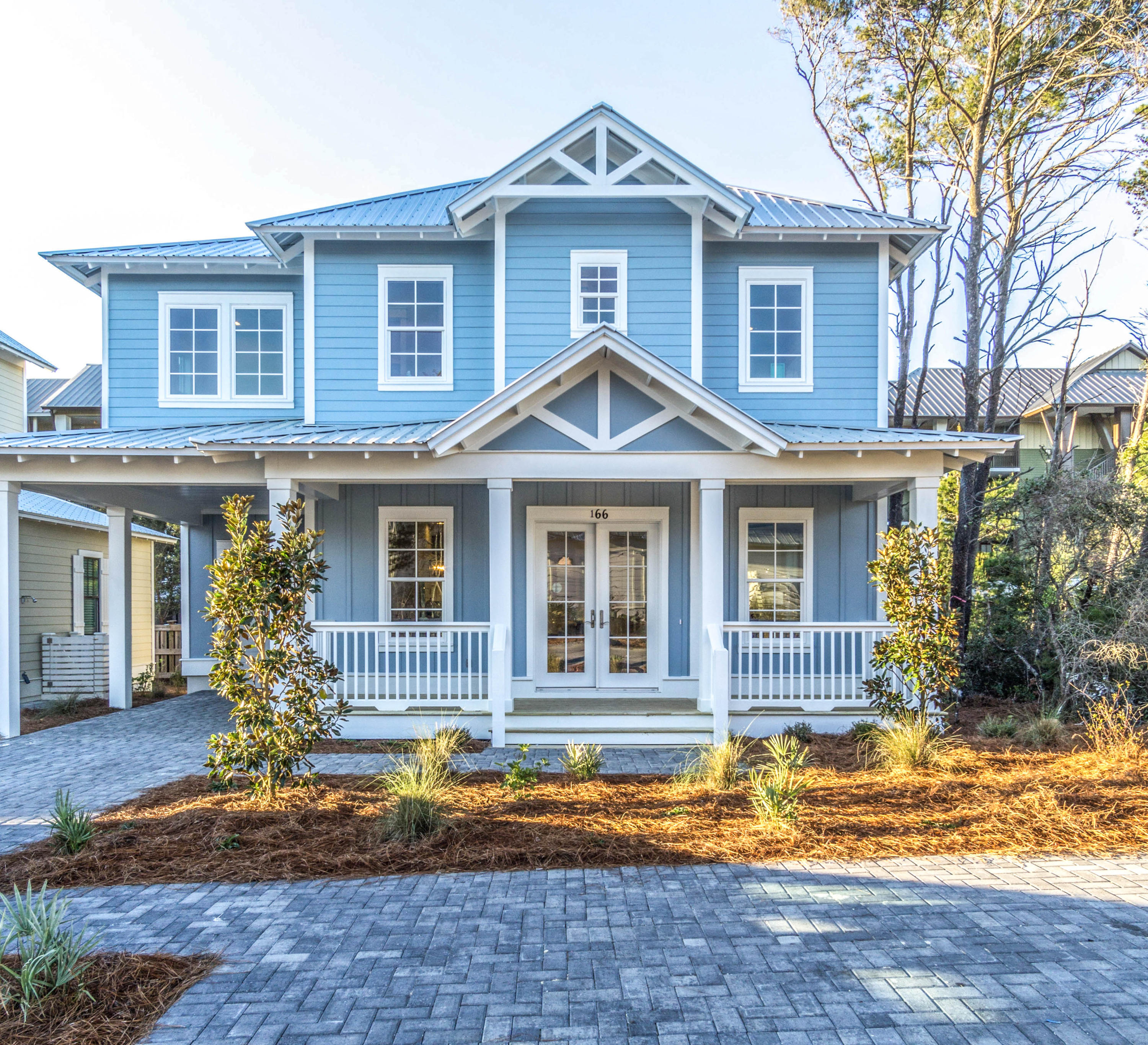 a front view of a house with garden