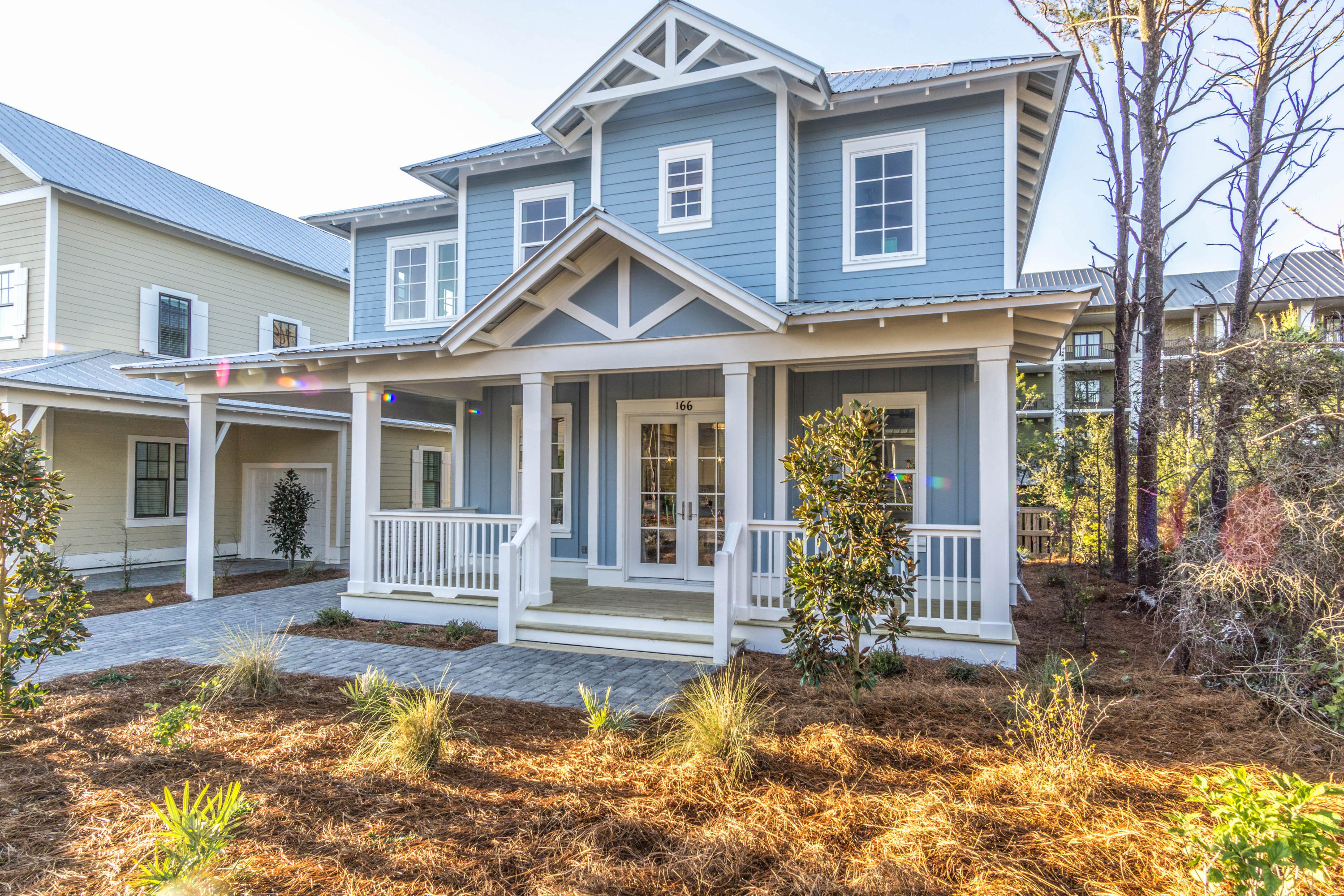 166 Cabana Trail Santa Rosa Beach, FL 32459 - Photo 15 of 62 a front view of a house with a yard