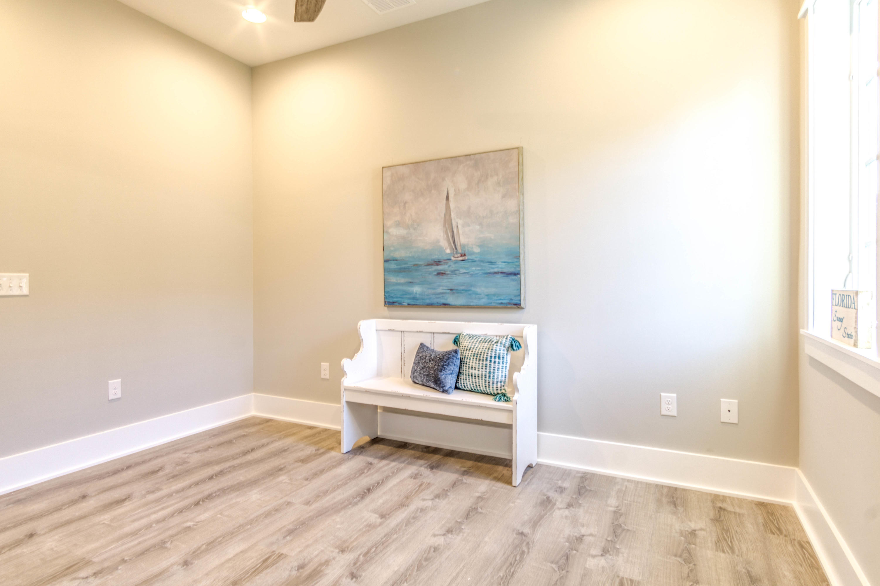 166 Cabana Trail Santa Rosa Beach, FL 32459 - Photo 32 of 62 a white room with wooden floor and white walls