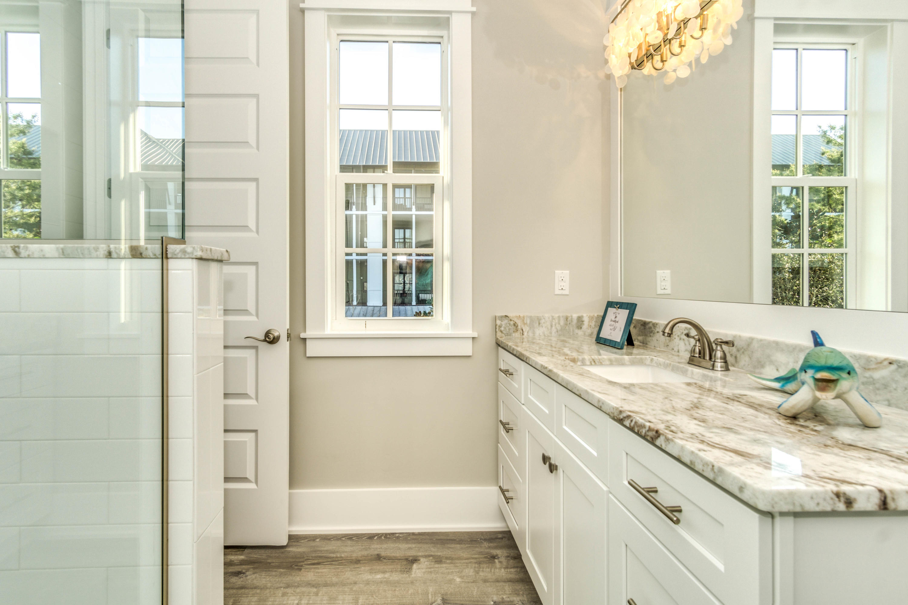 166 Cabana Trail Santa Rosa Beach, FL 32459 - Photo 33 of 62 a bathroom with a granite countertop sink and a window