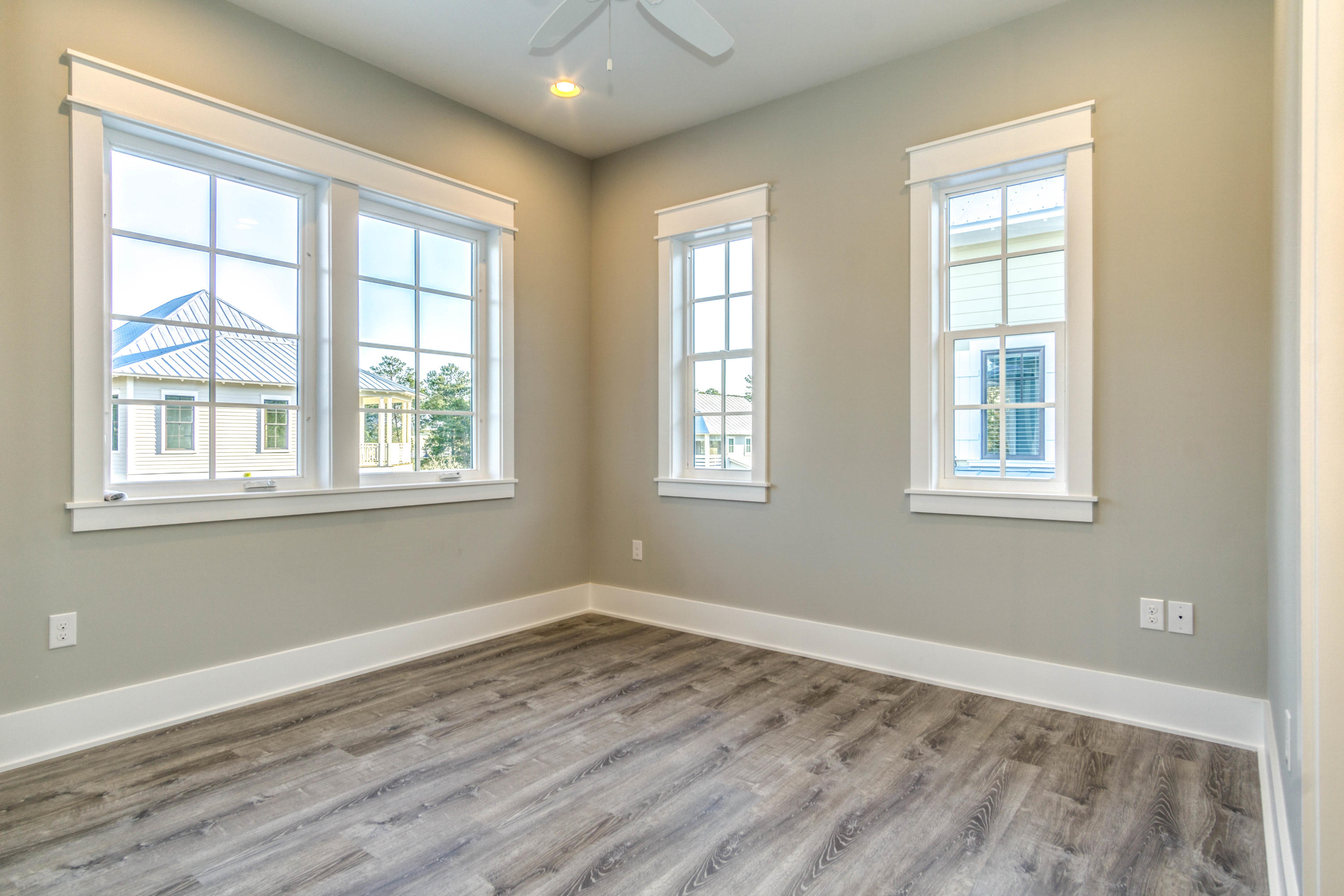 166 Cabana Trail Santa Rosa Beach, FL 32459 - Photo 35 of 62 a view of empty room with wooden floor and fan