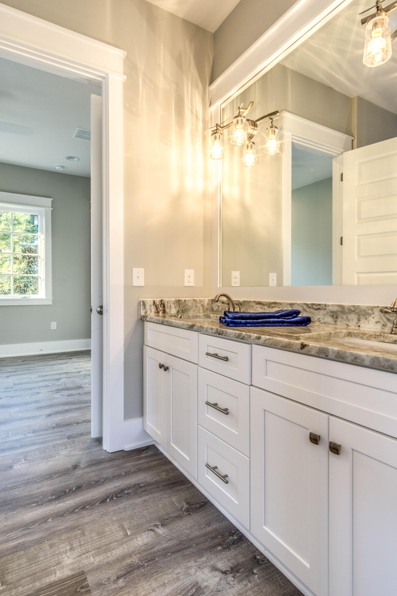 166 Cabana Trail Santa Rosa Beach, FL 32459 - Photo 37 of 62 a bathroom with a granite countertop sink and a mirror