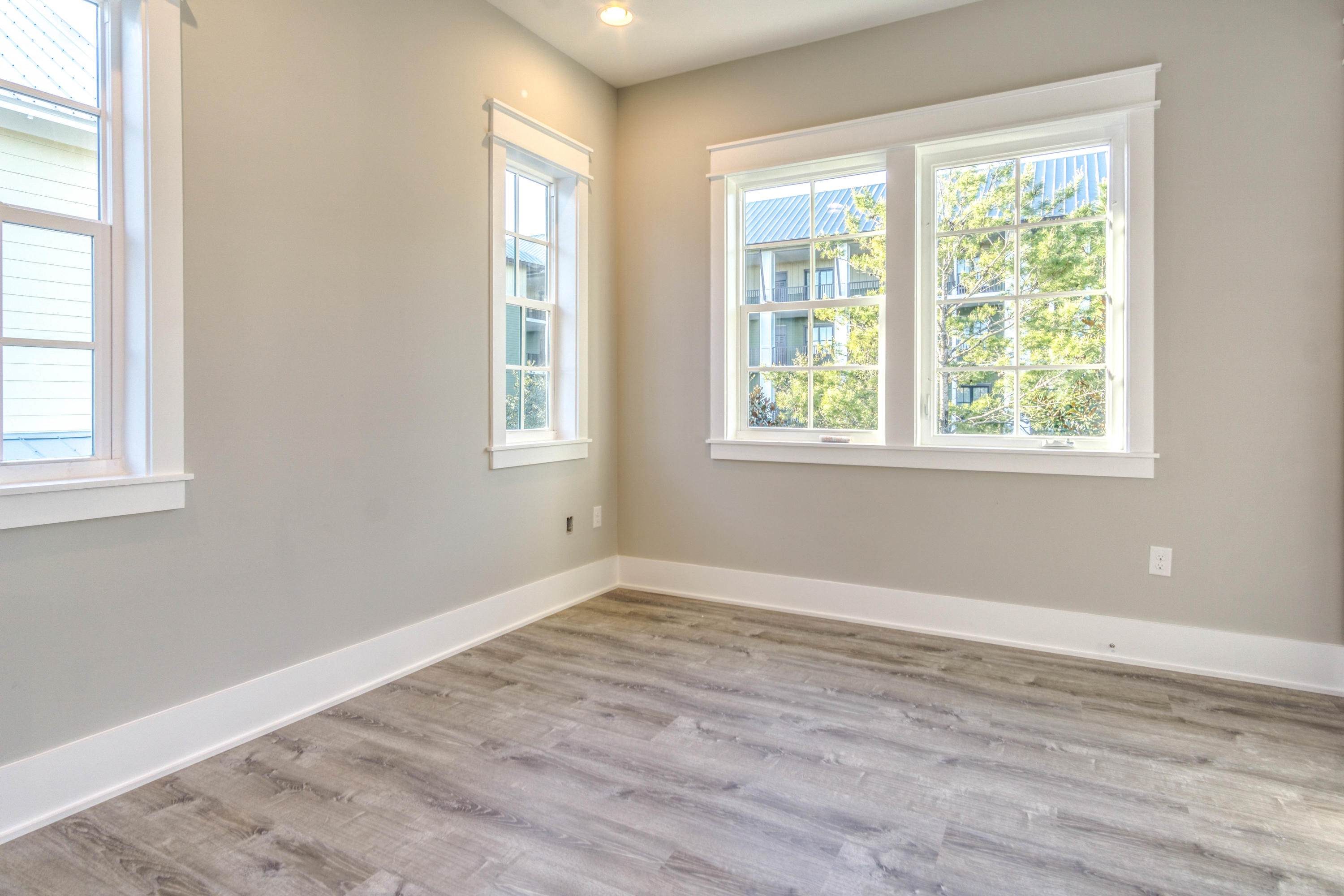 166 Cabana Trail Santa Rosa Beach, FL 32459 - Photo 38 of 62 an empty room with wooden floor and windows