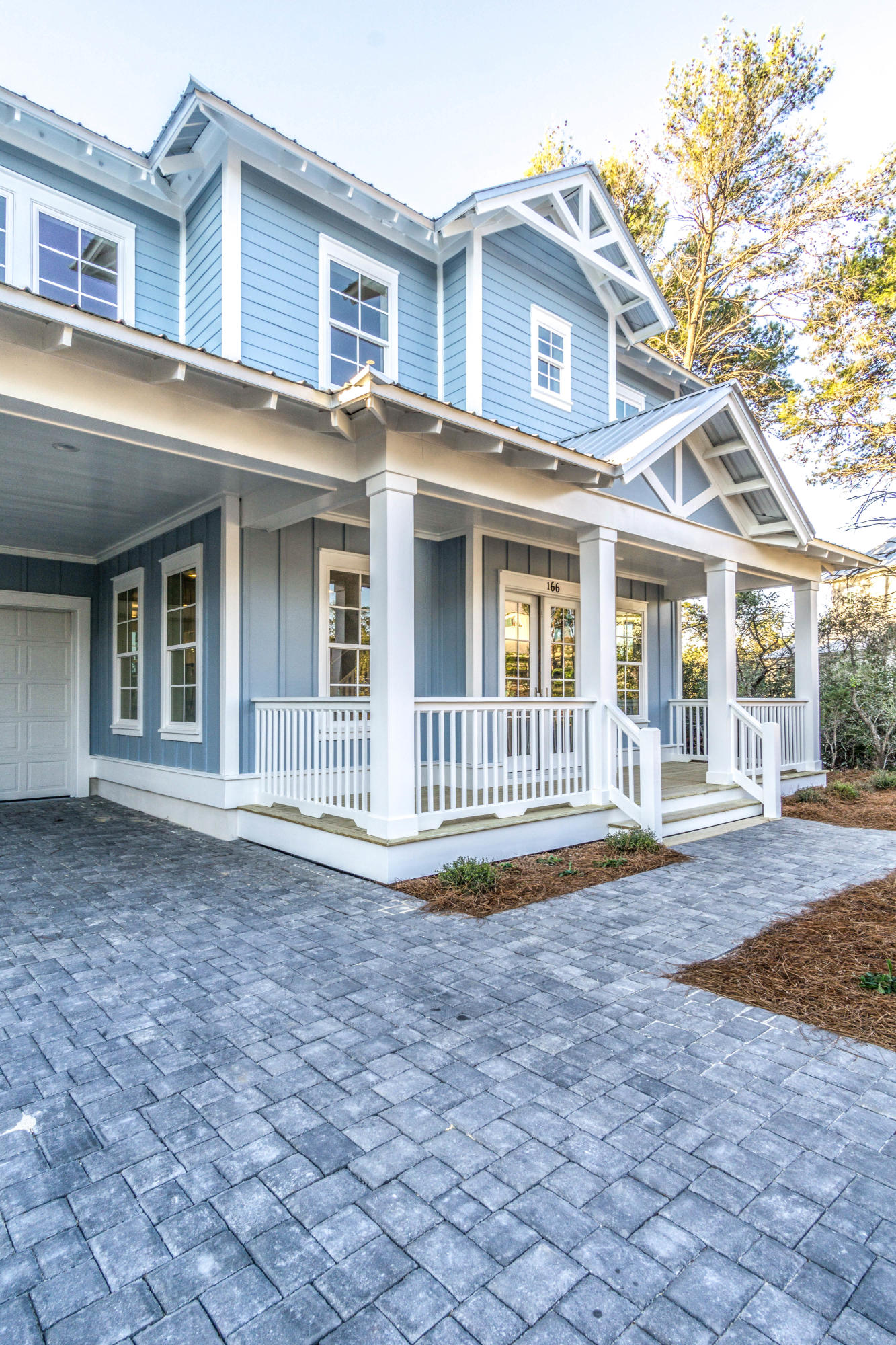 166 Cabana Trail Santa Rosa Beach, FL 32459 - Photo 40 of 62 a front view of a house with a yard