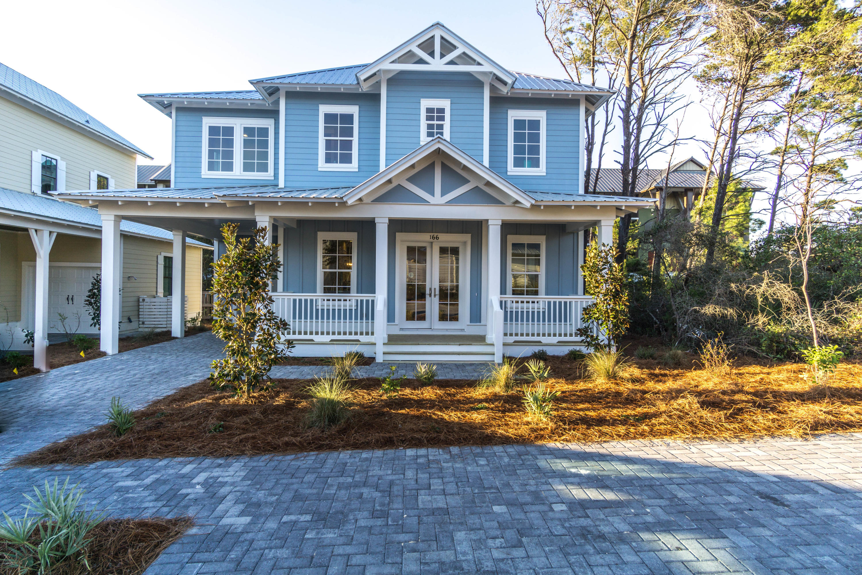 166 Cabana Trail Santa Rosa Beach, FL 32459 - Photo 61 of 62 a front view of a house with garden
