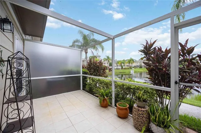 a view of swimming pool with outdoor seating and plants