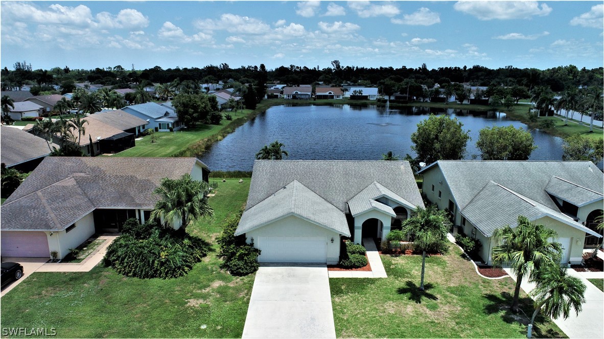 13273 Heather Ridge Loop Fort Myers, FL 33966 - Photo 1 of 21 an aerial view of a house with a yard