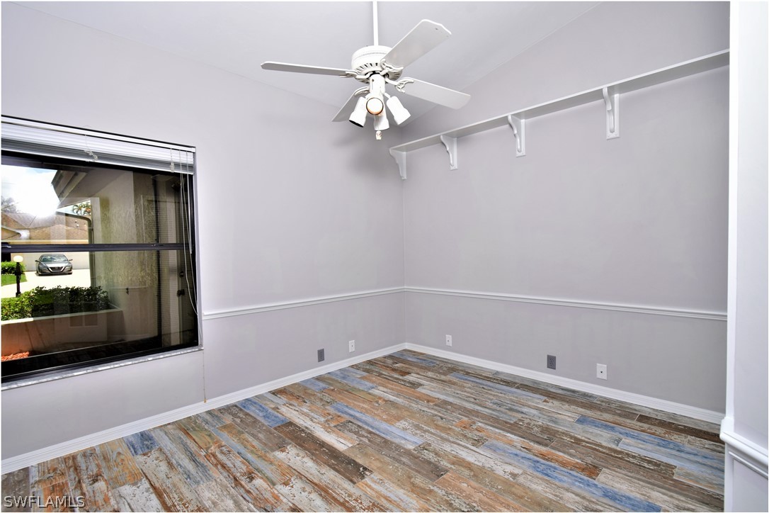 13273 Heather Ridge Loop Fort Myers, FL 33966 - Photo 18 of 21 a view of a room with rack on the wall and a chandelier
