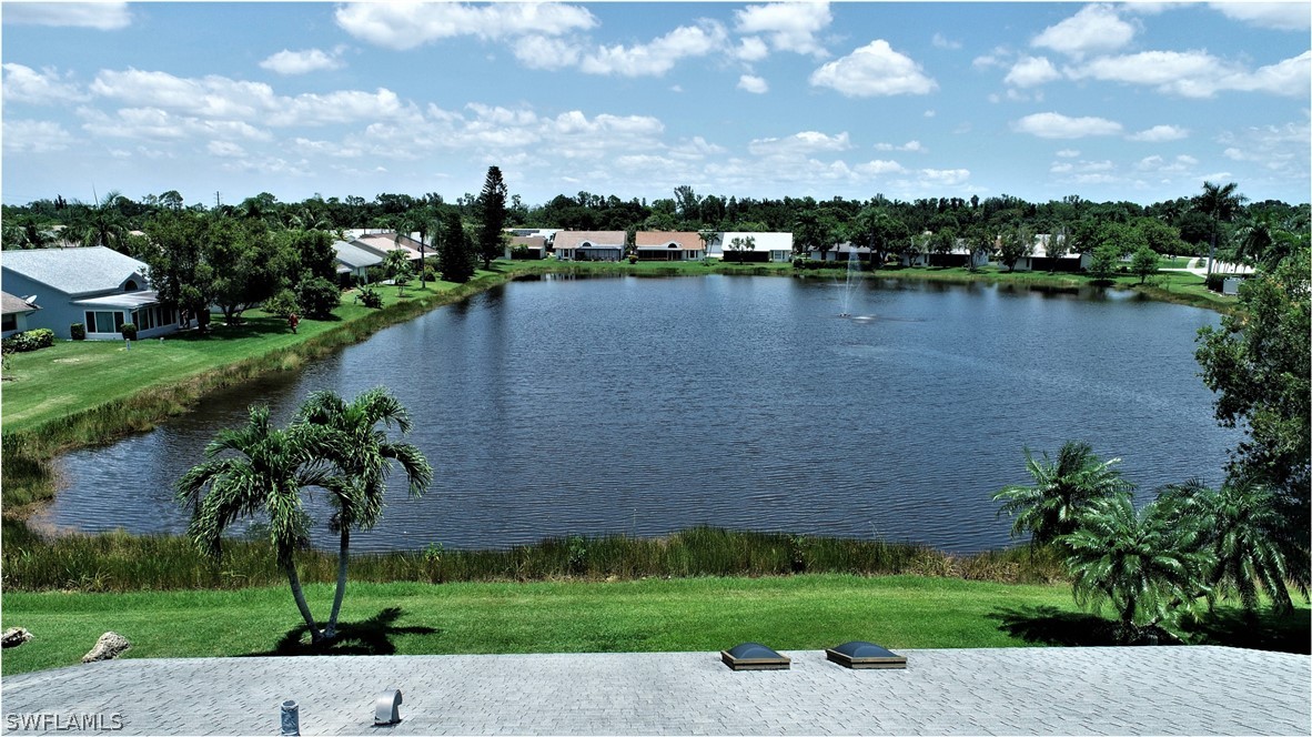 13273 Heather Ridge Loop Fort Myers, FL 33966 - Photo 3 of 21 a view of a lake with houses in the back