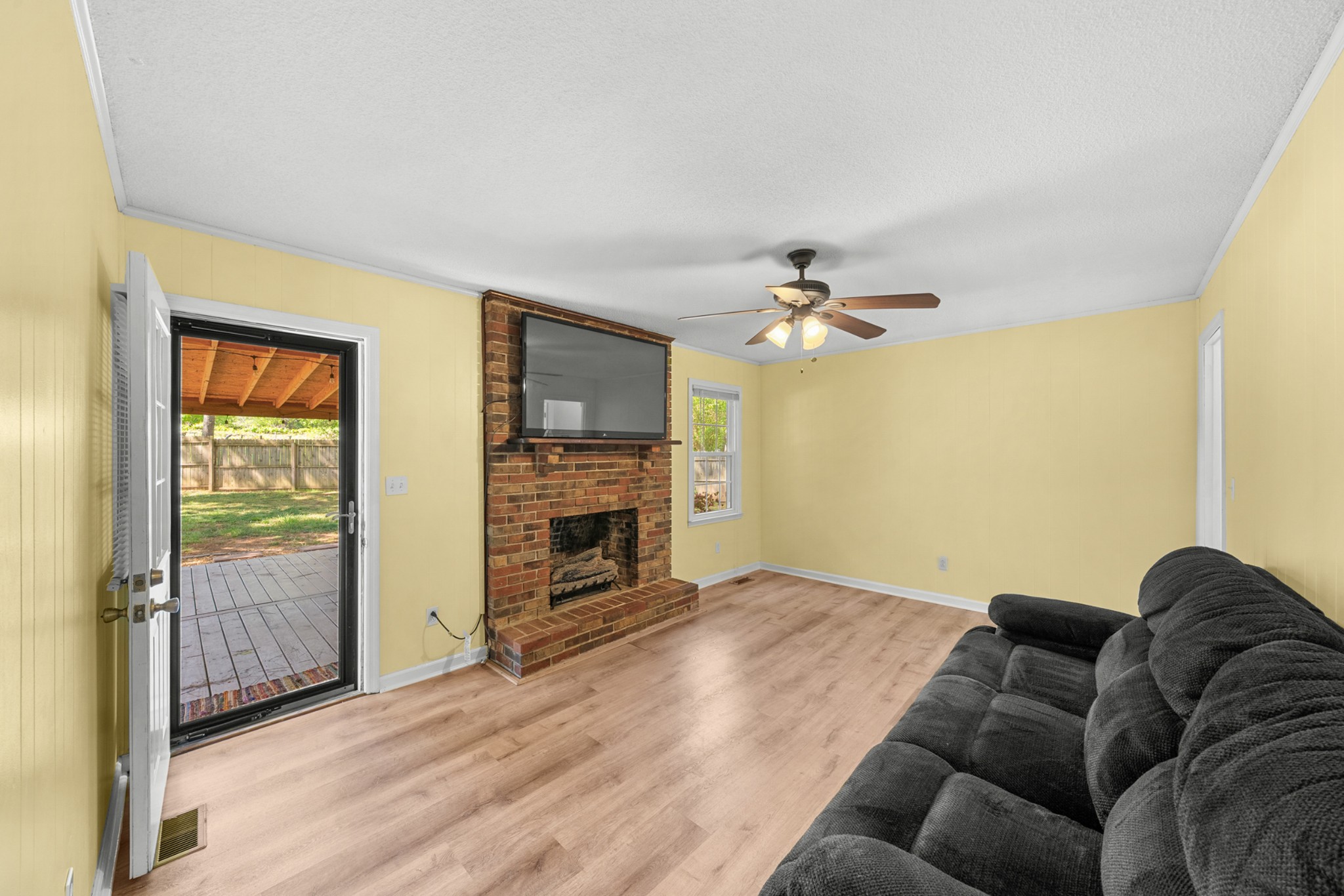 50 Maple Drive Winchester, TN 37398 - Photo 29 of 47 a living room with furniture a fireplace and a flat screen tv