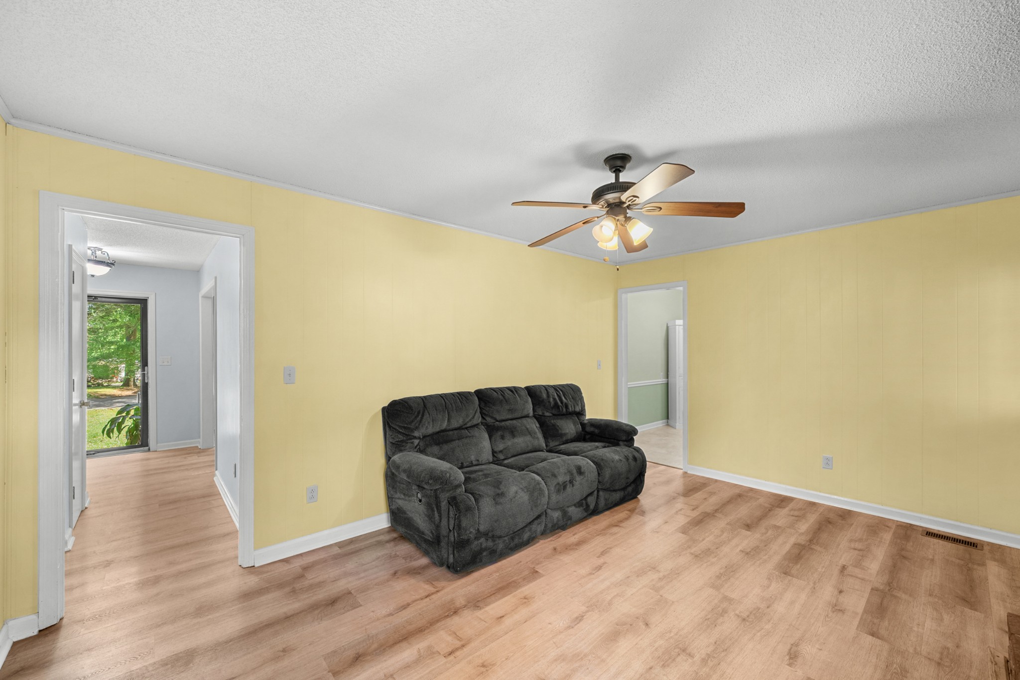50 Maple Drive Winchester, TN 37398 - Photo 31 of 47 a living room with furniture and a chandelier