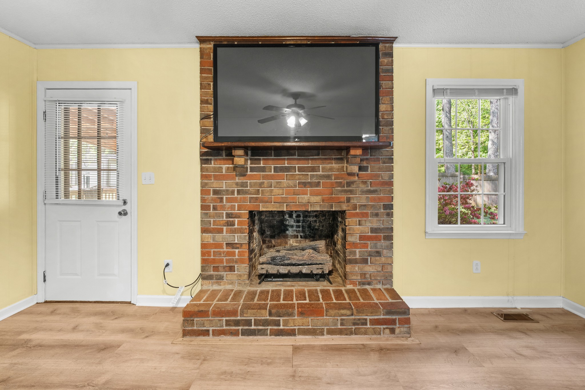 50 Maple Drive Winchester, TN 37398 - Photo 32 of 47 a living room with a fireplace and a flat screen tv