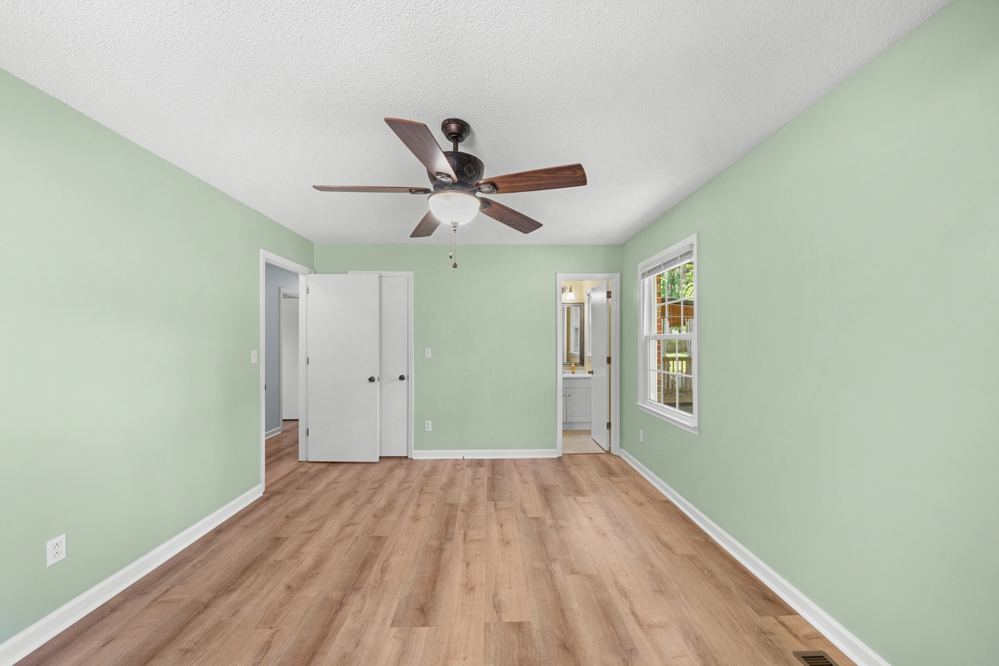 50 Maple Drive Winchester, TN 37398 - Photo 36 of 47 a view of a big room with wooden floor and a ceiling fan