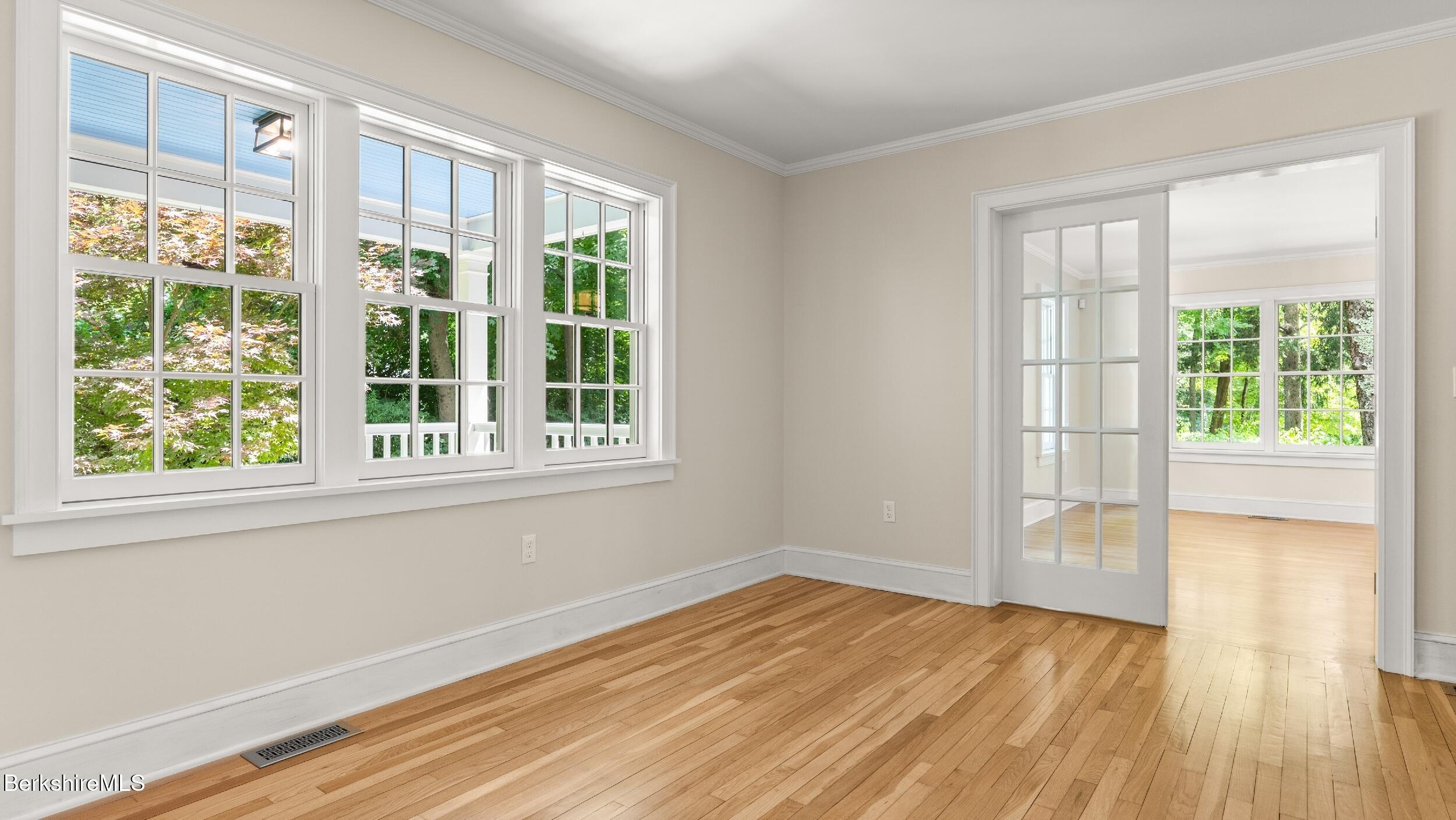 55 Main Street Stockbridge, MA 01262 - Photo 20 of 54 a view of an empty room with wooden floor and a window