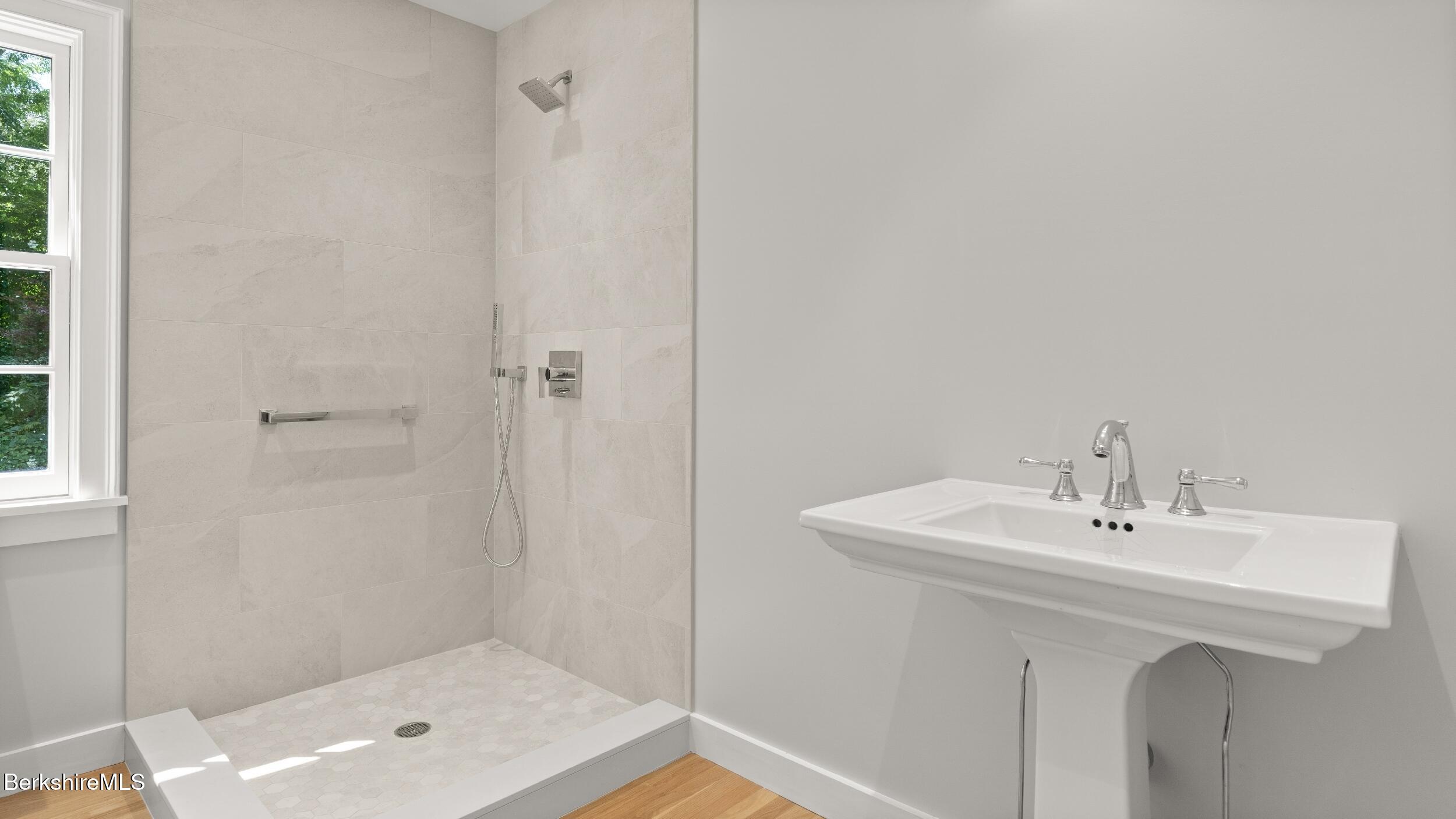 55 Main Street Stockbridge, MA 01262 - Photo 21 of 54 a bathroom with a sink a mirror and a shower